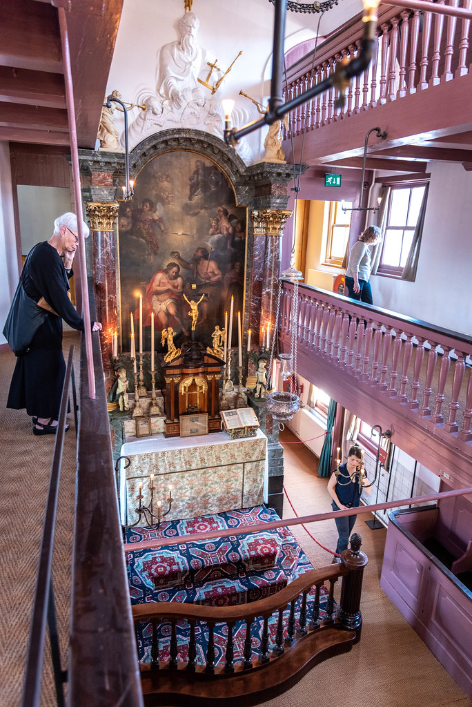 Multi-level altar and ornate wooden galleries of the clandestine attic church inside Ons' Lieve Heer op Solder