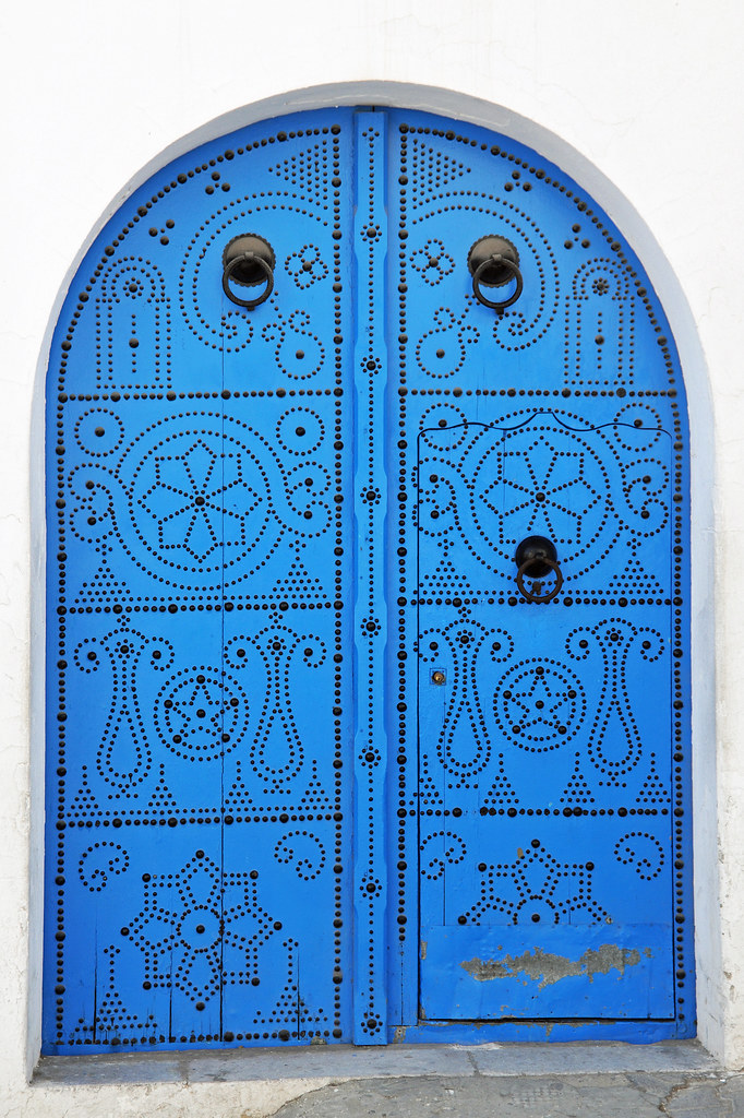 Whitewashed buildings with cyan blue doors and Mediterranean views in Sidi Bou Said Tunisia
