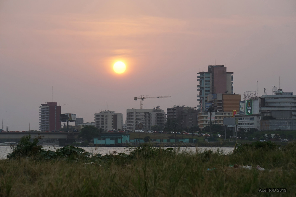 Panoramic skyline of Le Plateau commercial district and Ébrié Lagoon in Abidjan, Côte d'Ivoire