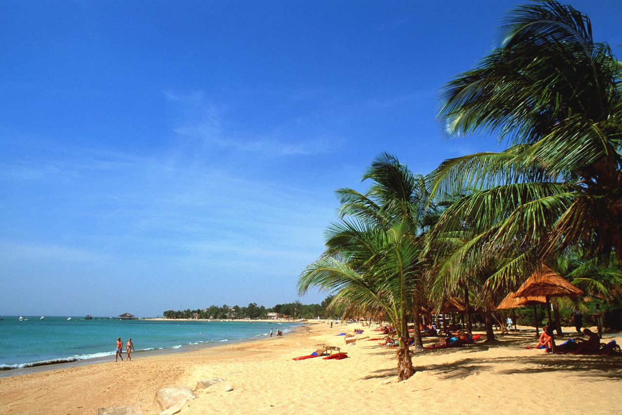 Golden sandy beach and palm trees in Saly Portudal on Senegal's Petite Côte