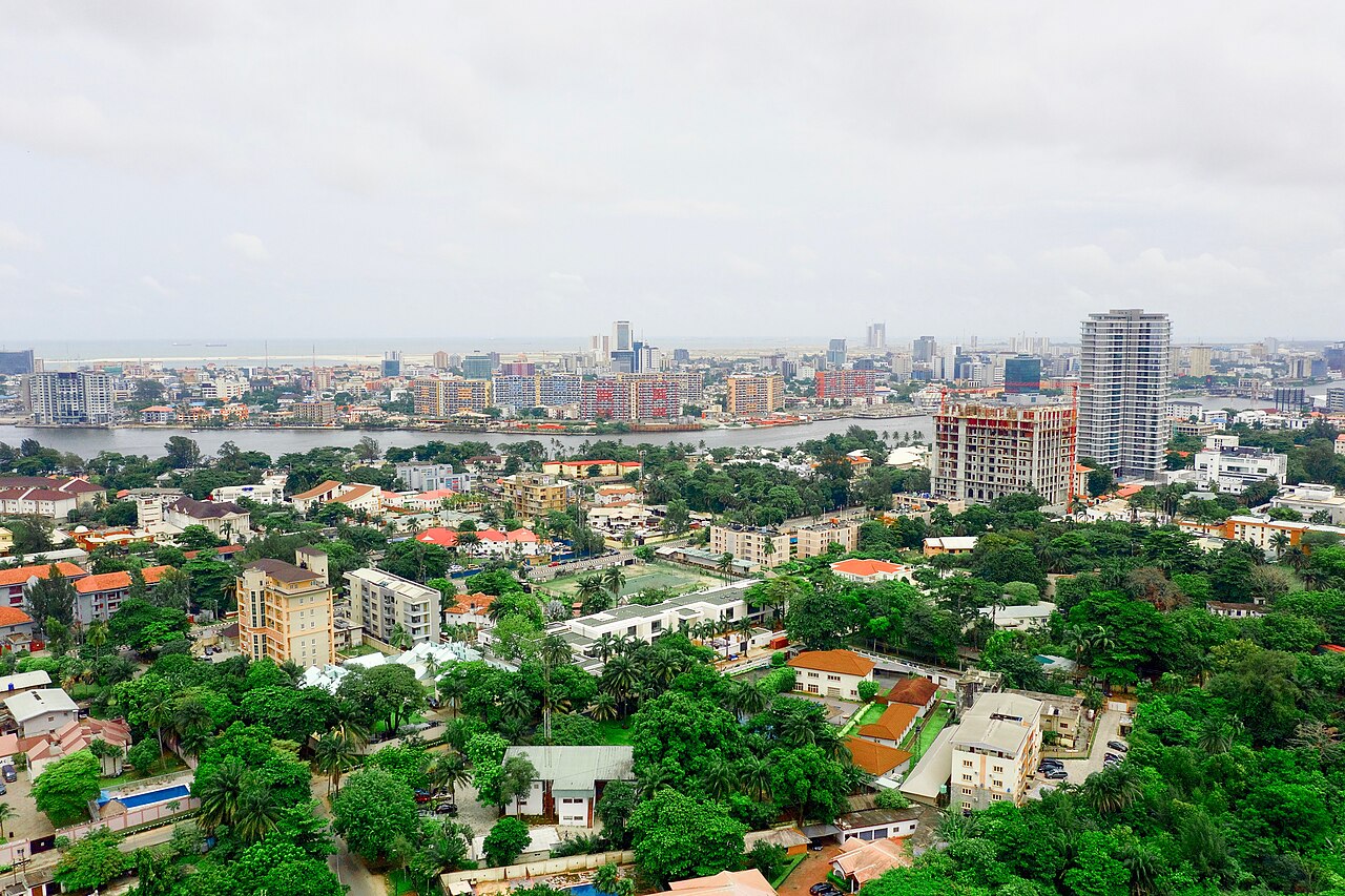 Aerial view of upscale residential estates, lush green canopies, and waterfront lagoons in Ikoyi, Lagos, Nigeria