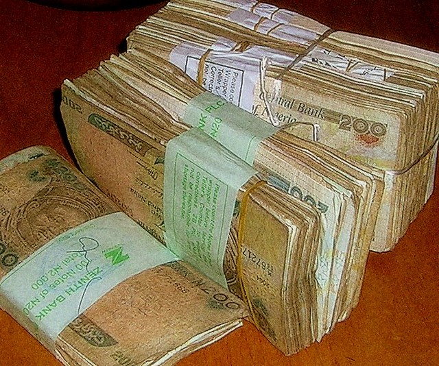 Nigerian Naira banknotes spread out for taxi fare in Nigeria
